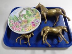 Three graduated solid brass horses together with four Royal Albert bone china plates