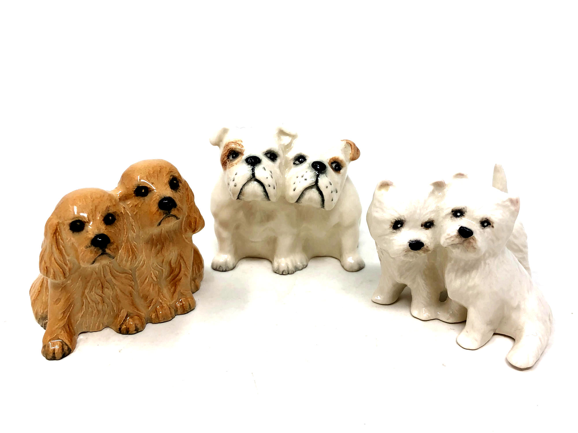 A Beswick china figure : Bulldogs (Seated), model 3384, white with pale tan patches, gloss,