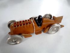 A cast iron model of a vintage racing car