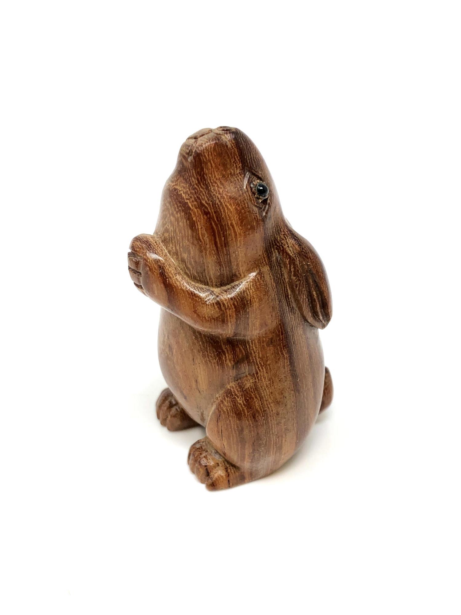 A Japanese carved hardwood netsuke : Praying Rabbit.