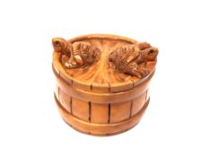 A Japanese carved hardwood netsuke : Two Turtles on a Barrel.