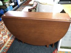 A mid 20th century teak G Plan drop leaf table, length 154cm,