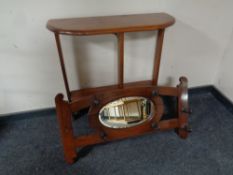 An Edwardian mirrored wall mounted coat rack together with a pine two tier D-shaped hall table