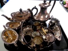 A tray containing assorted plated wares to include a four piece tea service, mugs,