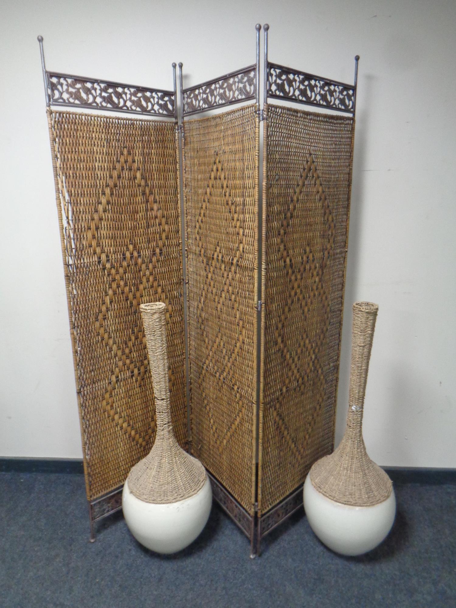 A metal and wicker three way folding screen together with a pair of contemporary pottery and wicker