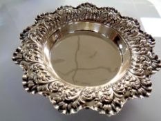 A silver embossed dish, Sheffield 1899, weight 83g, diameter 16.