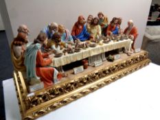 A Capodimonte figure, The Last Supper by Germano Cortese, on a gilt plinth, width 93.