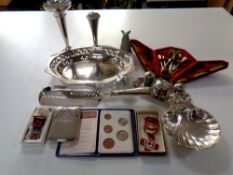 A tray containing assorted antique and later plated wares to include a red velvet cased manicure