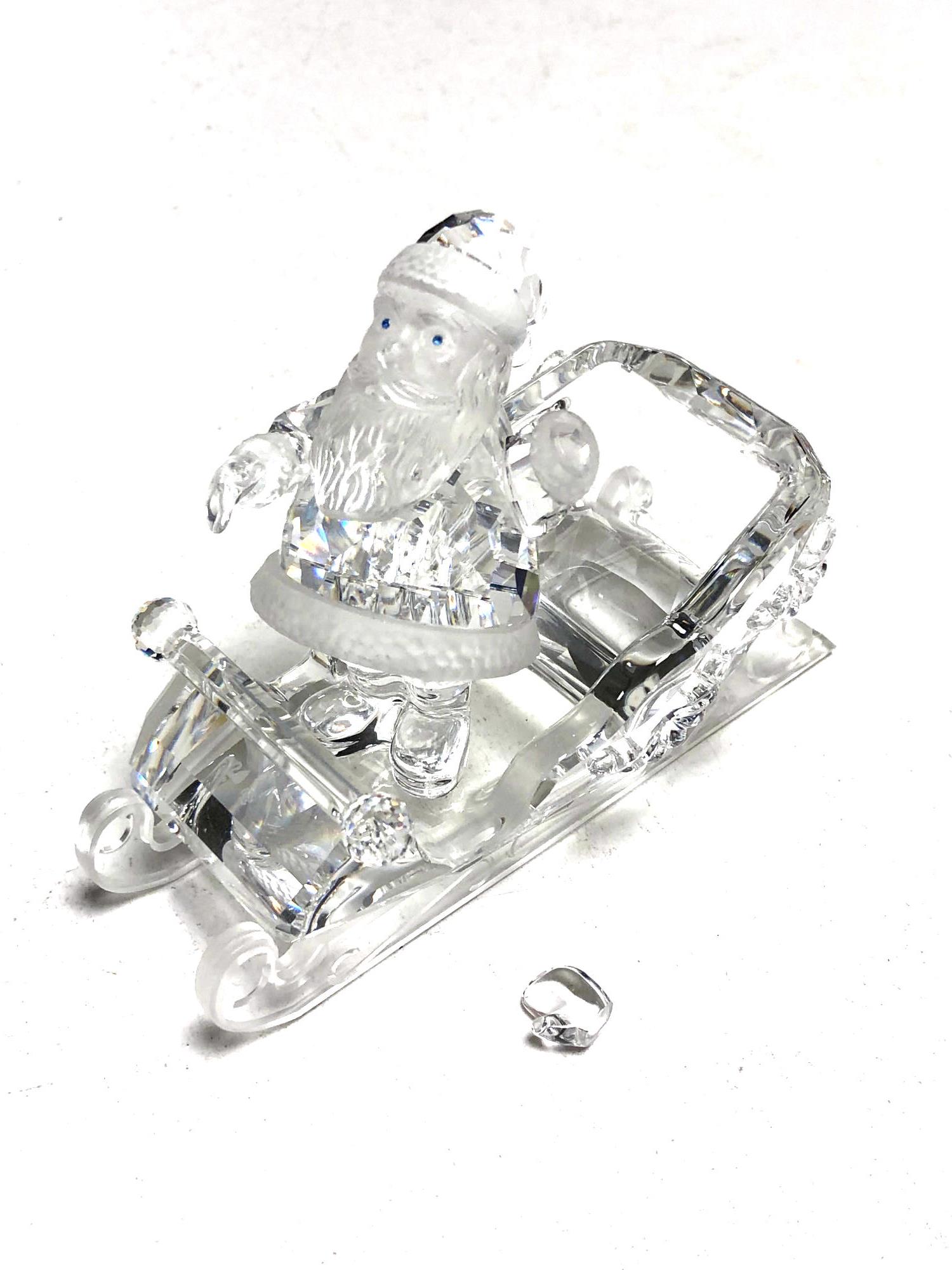 A Swarovski crystal Santa with sleigh (as found) CONDITION REPORT: Left mitten