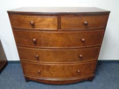 A Victorian style bow fronted five drawer chest