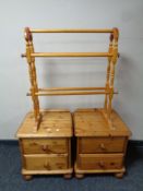 A pair of contemporary pine two drawer bedside chests together with a pine towel rail