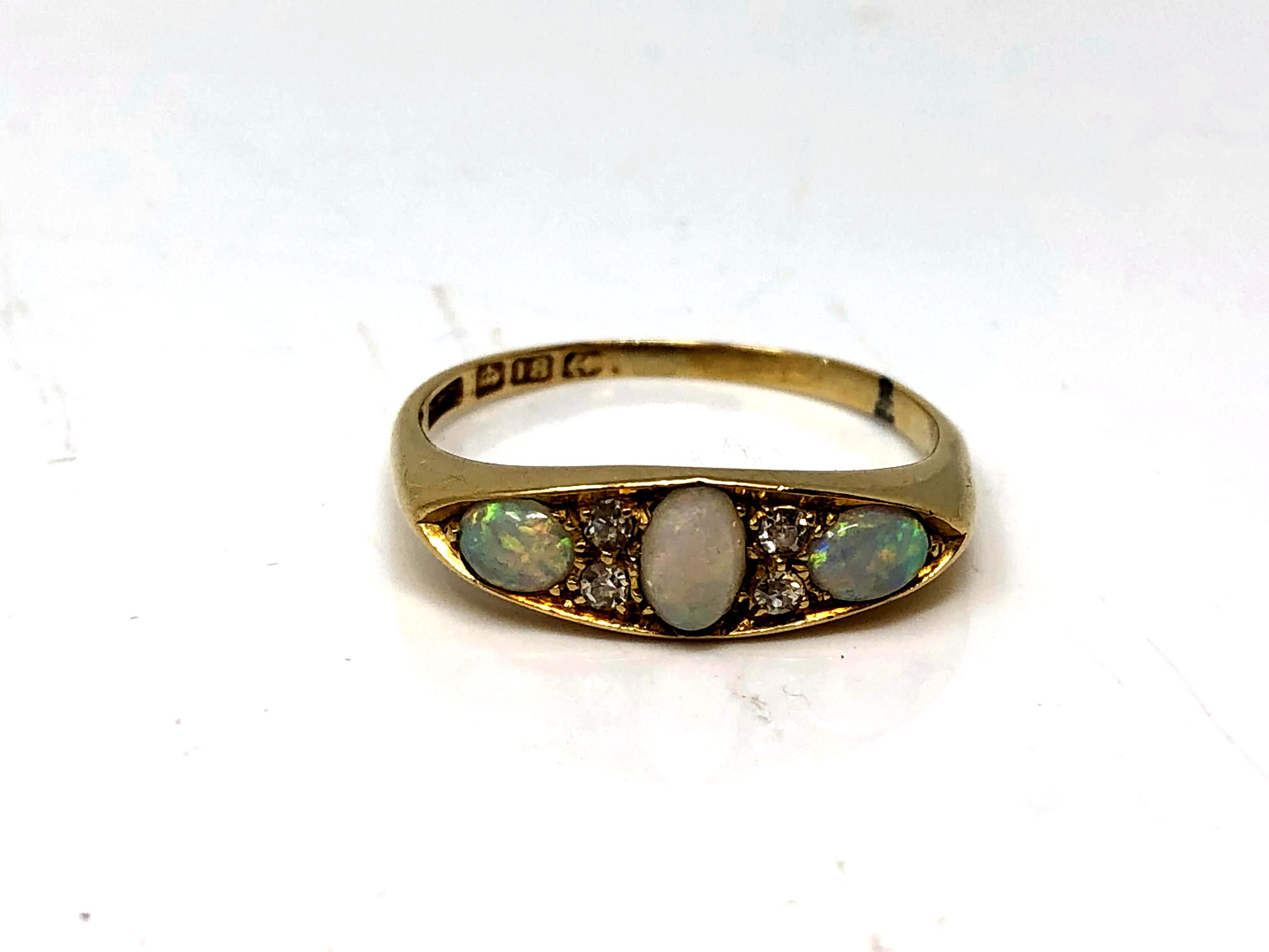 An antique 18ct gold opal and diamond ring, size Q. CONDITION REPORT: 3.