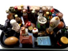 A tray containing a quantity of alcohol miniatures and bottles