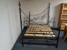 An ornate 4ft 6 wrought iron bed frame with pair of matching bedside tables