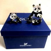 A Swarovski Crystal Society Endangered Wildlife Series panda with cub,