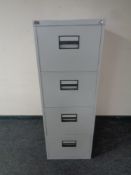 A four drawer metal filing cabinet