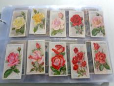 An album containing a large quantity of cigarette cards to include Wills, John Player Special,