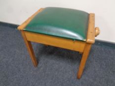 A 20th century adjustable storage piano stool