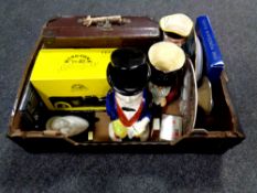 A box containing antique Toby jugs, porcelain plates, Ringtons ceramic Morris miner,