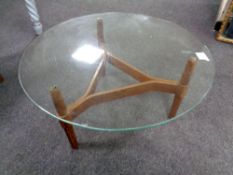 A 20th century Swedish Mobel circular glass topped coffee table on teak legs