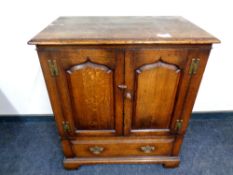 A Titchmarsh and Goodwin Georgian style cabinet fitted a drawer