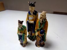 Three 20th century glazed pottery figures,
