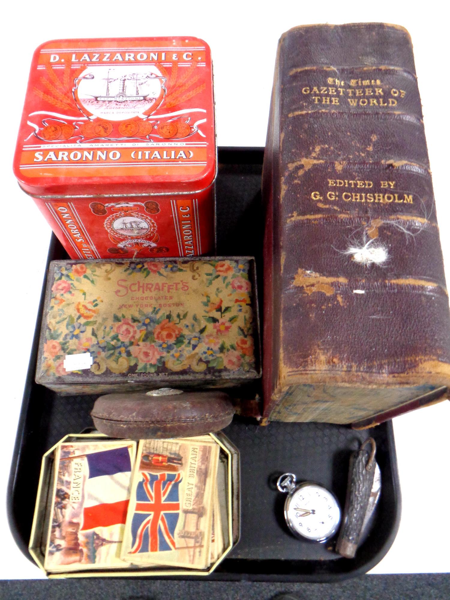 A tray containing miscellaneous to include vintage tins, flags of the world cards,