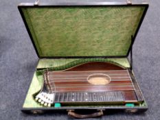 An antique Emanuel Kraus zither in a fitted box