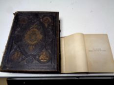 A 19th century leather bound family bible together with one further 20th century volume The