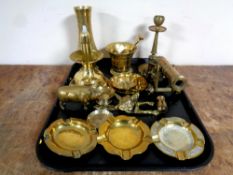 A tray containing assorted brass ware to include canon pestle and mortar, pig ornament,