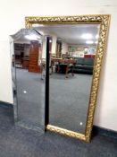 A decorative gilt framed bevel edged mirror together with an all glass Venetian style mirror