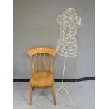 A pine kitchen chair together with a wire metal mannequin on stand