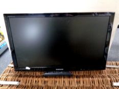 A Samsung Syncmaster T24 B300 24'' LED TV with remote