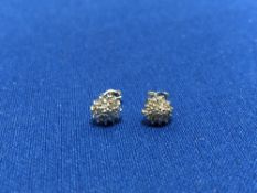 A pair of diamond cluster stud earrings