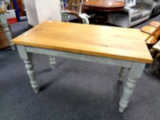 An oak topped kitchen table on painted base, length 120 cm,