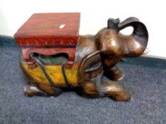 A carved hardwood elephant plant stand