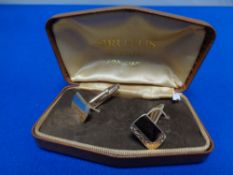 A pair of gold plated silver cuff links