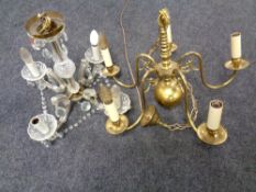 A 20th century brass five arm chandelier together with a further glass four arm chandelier