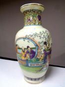 A Japanese vase depicting geishas