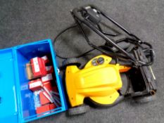 A Worx electric lawn mower with charger together with a metal box containing Hilti nail gun nails