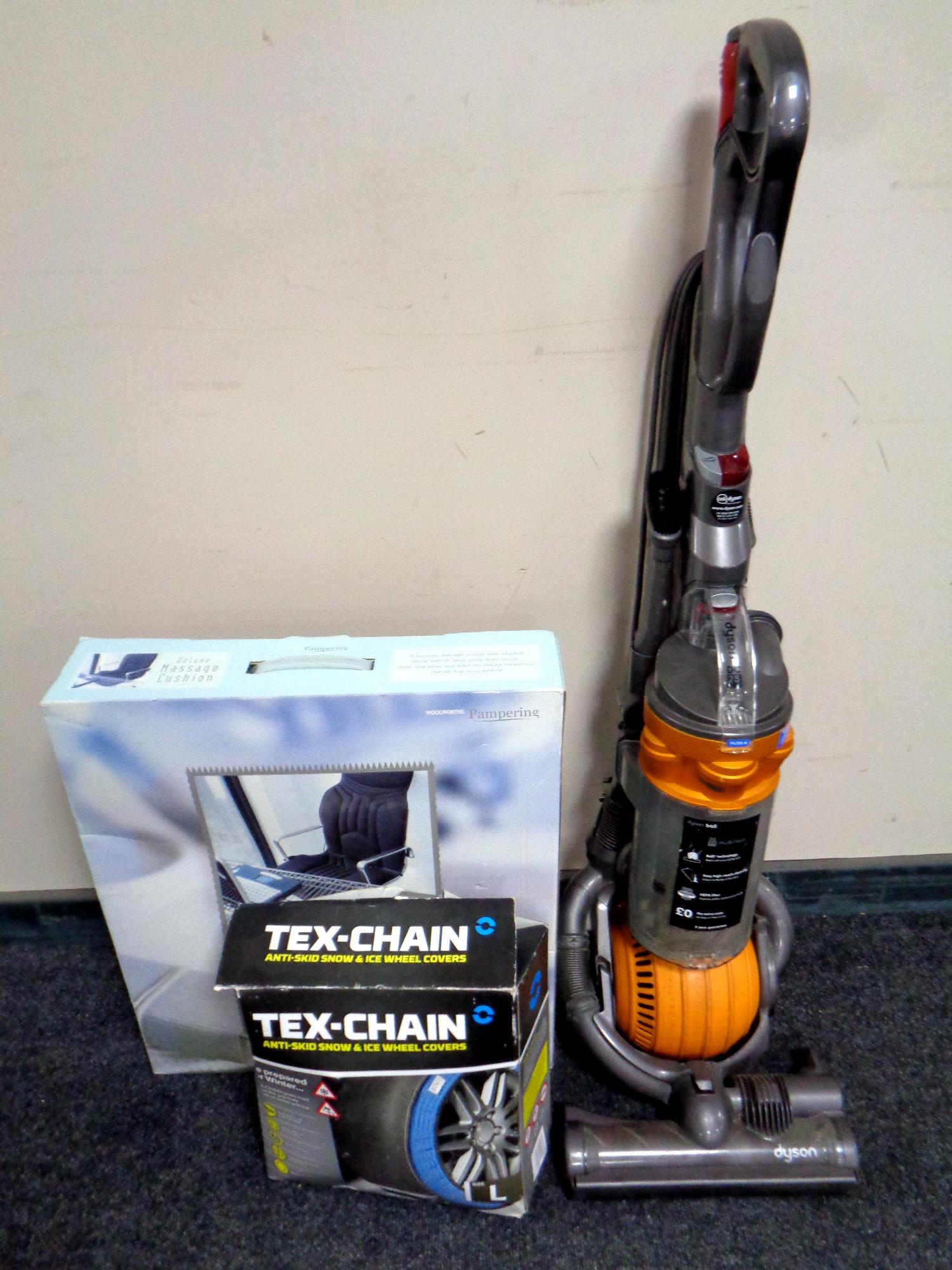 A Dyson DC25 ball vacuum together with a boxed Deluxe massage cushion and a boxed set of Tex-chain