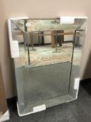 An all glass bevelled mirror,