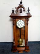 An Edwardian mahogany cased Vienna wall clock with brass and enamel dial,