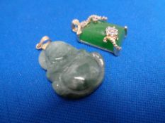 A Chinese hardstone pendant together with a sterling silver Chinese pendant (2)