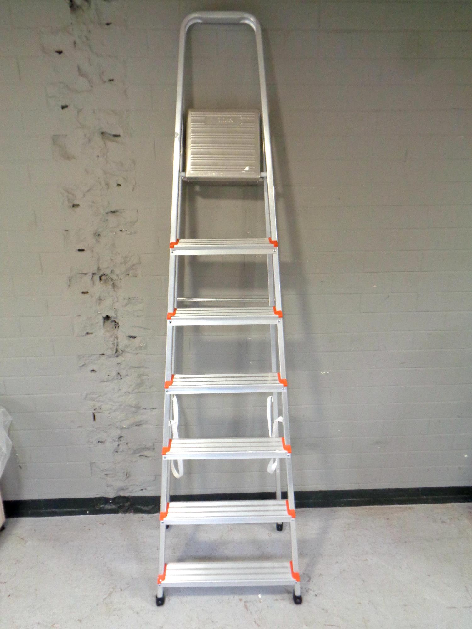 A set of Titan aluminium folding step ladders