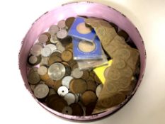 A circular box containing British and continental coins,