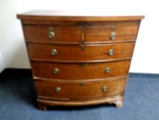 A 19th century mahogany bow fronted two over three drawer chest