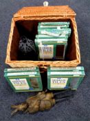 A wicker picnic basket containing ten packs of mirrored tiles together with a contemporary rabbit