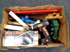 A box of hand and power tools : saws, spirit levels, electric planer,