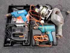 A crate of power tools to include Stanley router, Performance multi saw, Black & Decker hand drills,